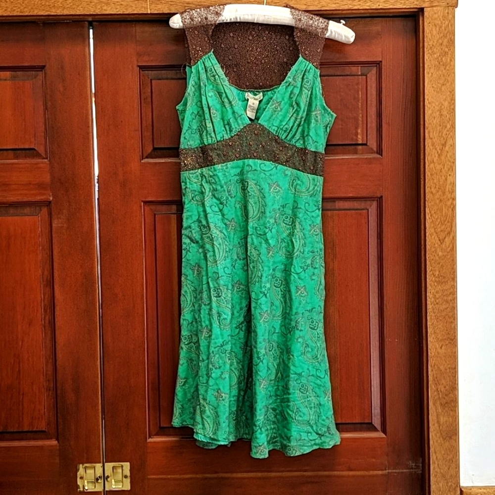 Green Harkham dress with gold net back.